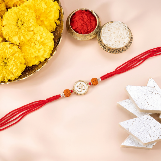 Elegant Om Charm Rudraksha Rakhi with Red Braided Thread