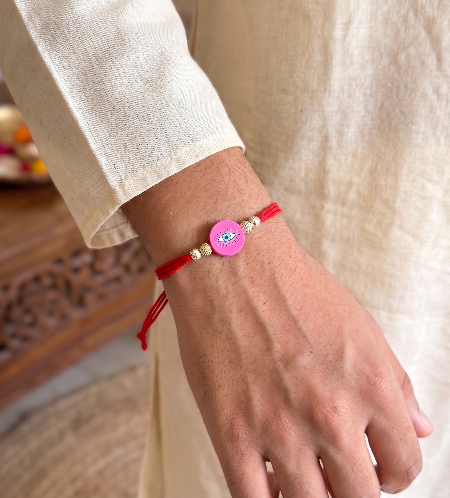 pink evil eye silver bead rakhi