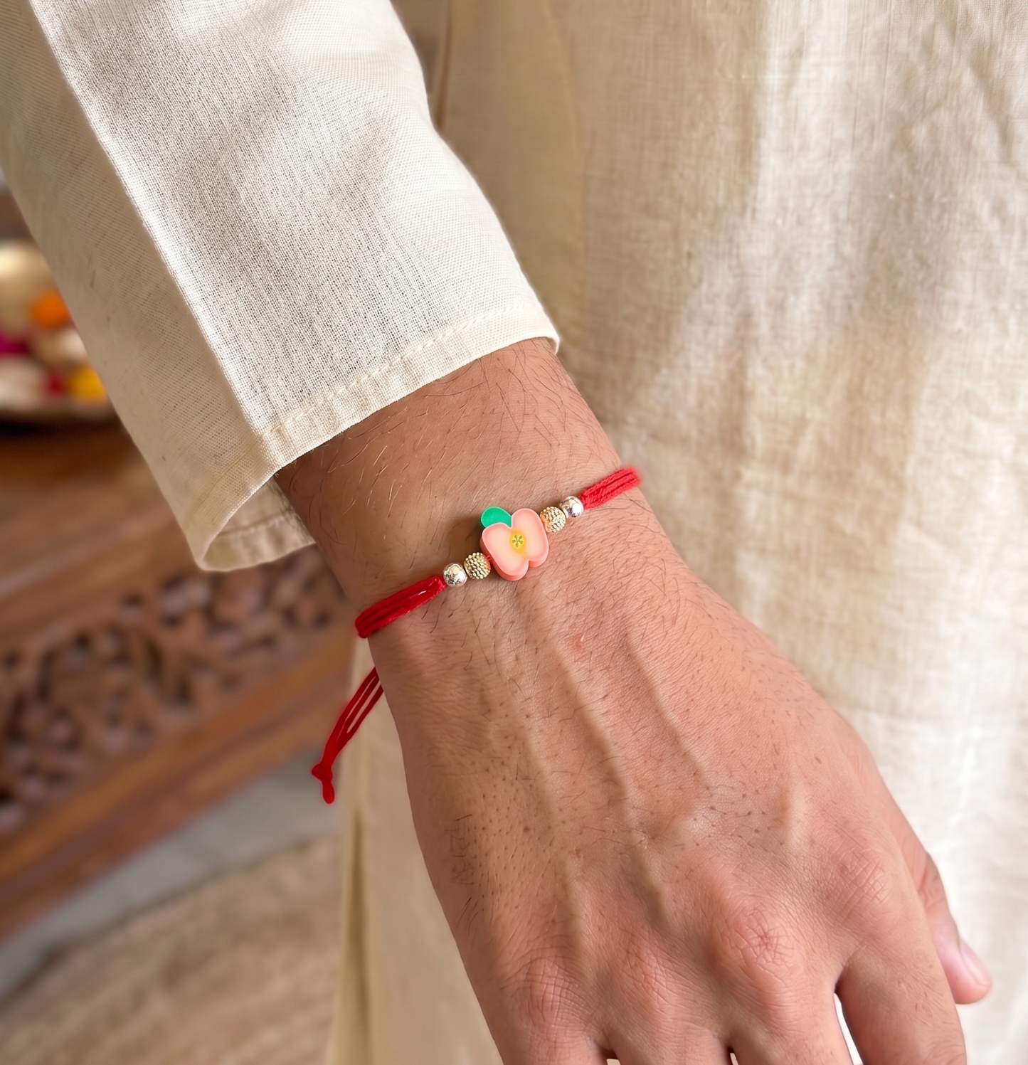 peach flower charm sparkle rakhi