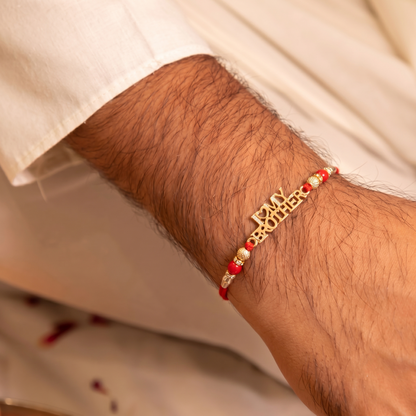 Divine Coin Charm Red Macramé Rakhi