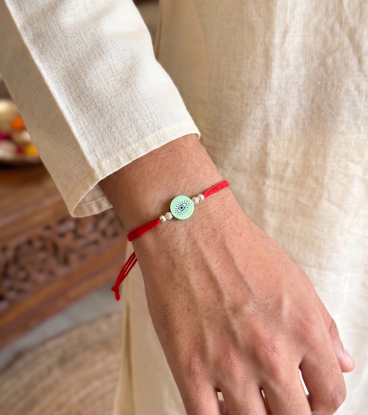 pink evil eye silver bead rakhi