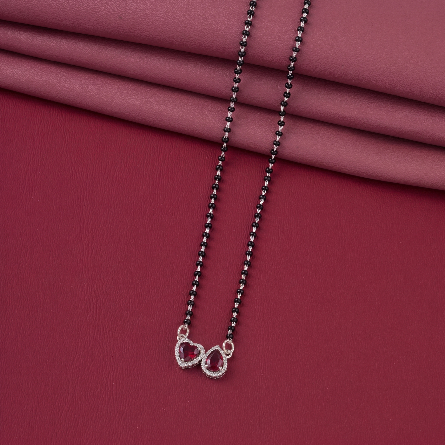 elegant silver-tone mangalsutra with black beads and dual heart & teardrop halo pendants
