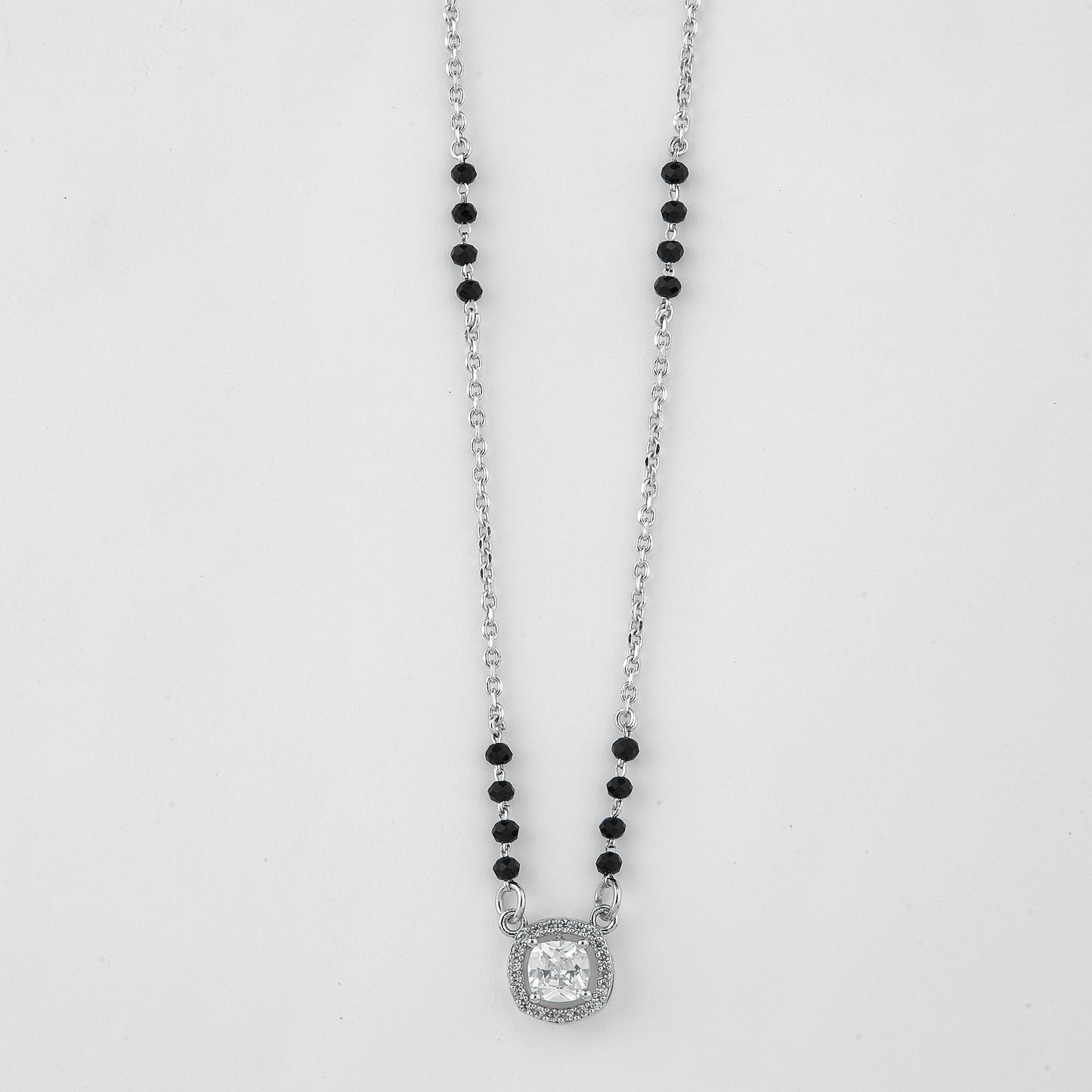 graceful silver-tone mangalsutra with black beads and sparkling cushion-cut pendant
