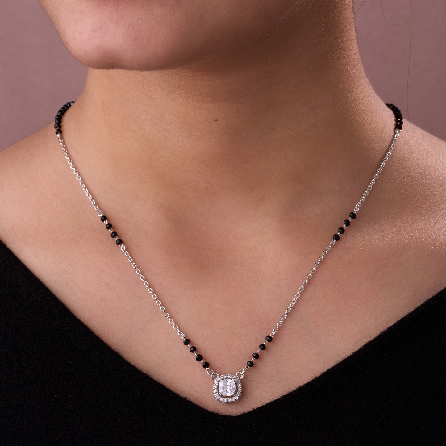 graceful silver-tone mangalsutra with black beads and sparkling cushion-cut pendant