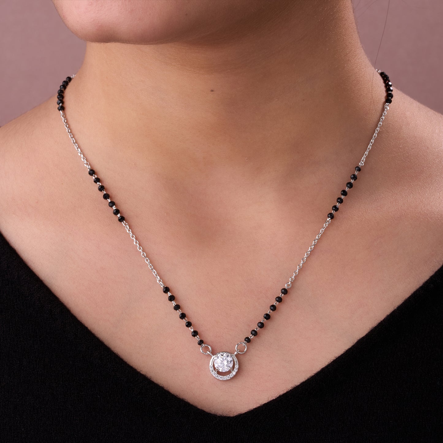 chic silver-tone mangalsutra with black beads and sparkling circular solitaire pendant