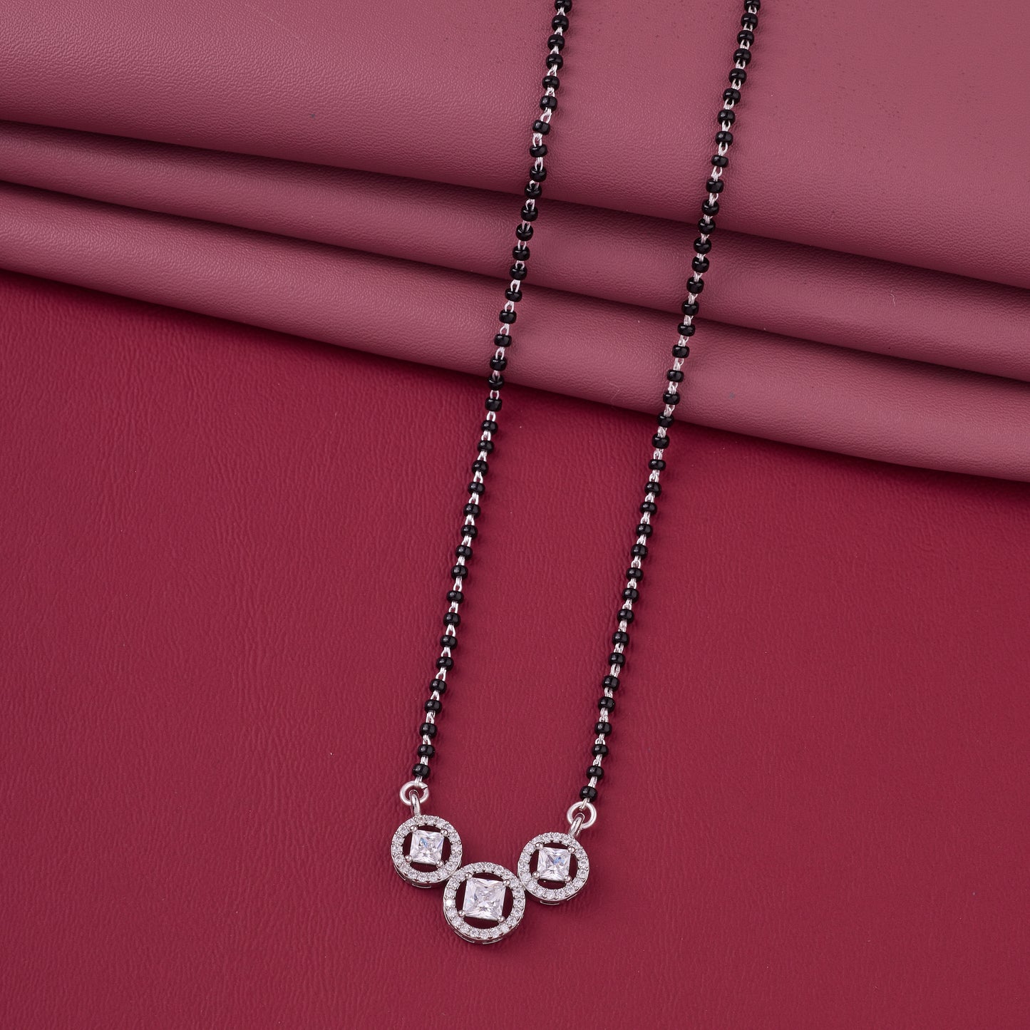 elegant silver-tone mangalsutra with black beads and triple square halo pendant design