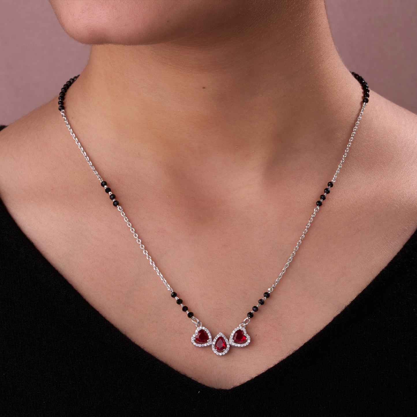 elegant silver-tone mangalsutra with black beads and triple teardrop stone pendant