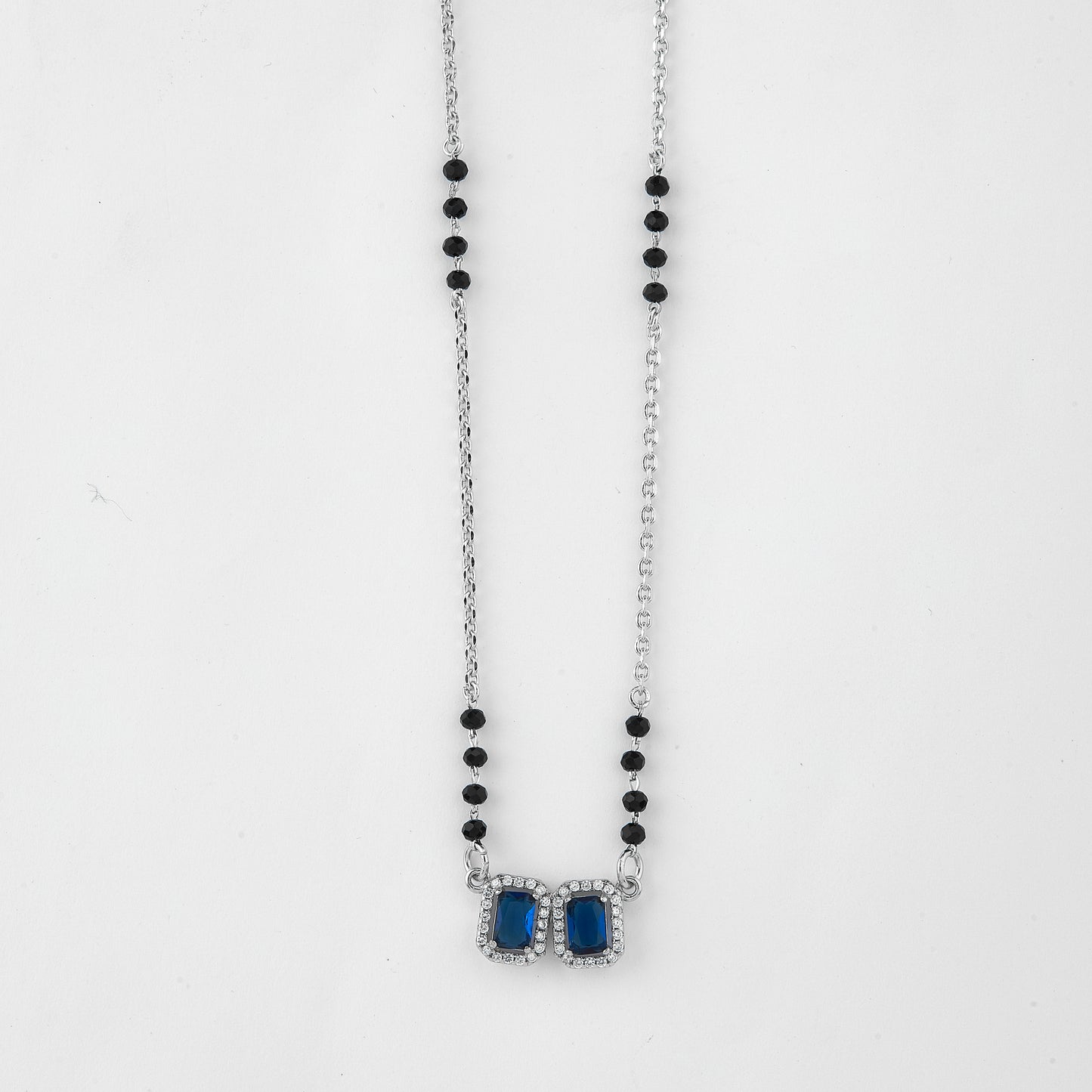 elegant silver-tone mangalsutra with black beads and dual rectangular halo pendants