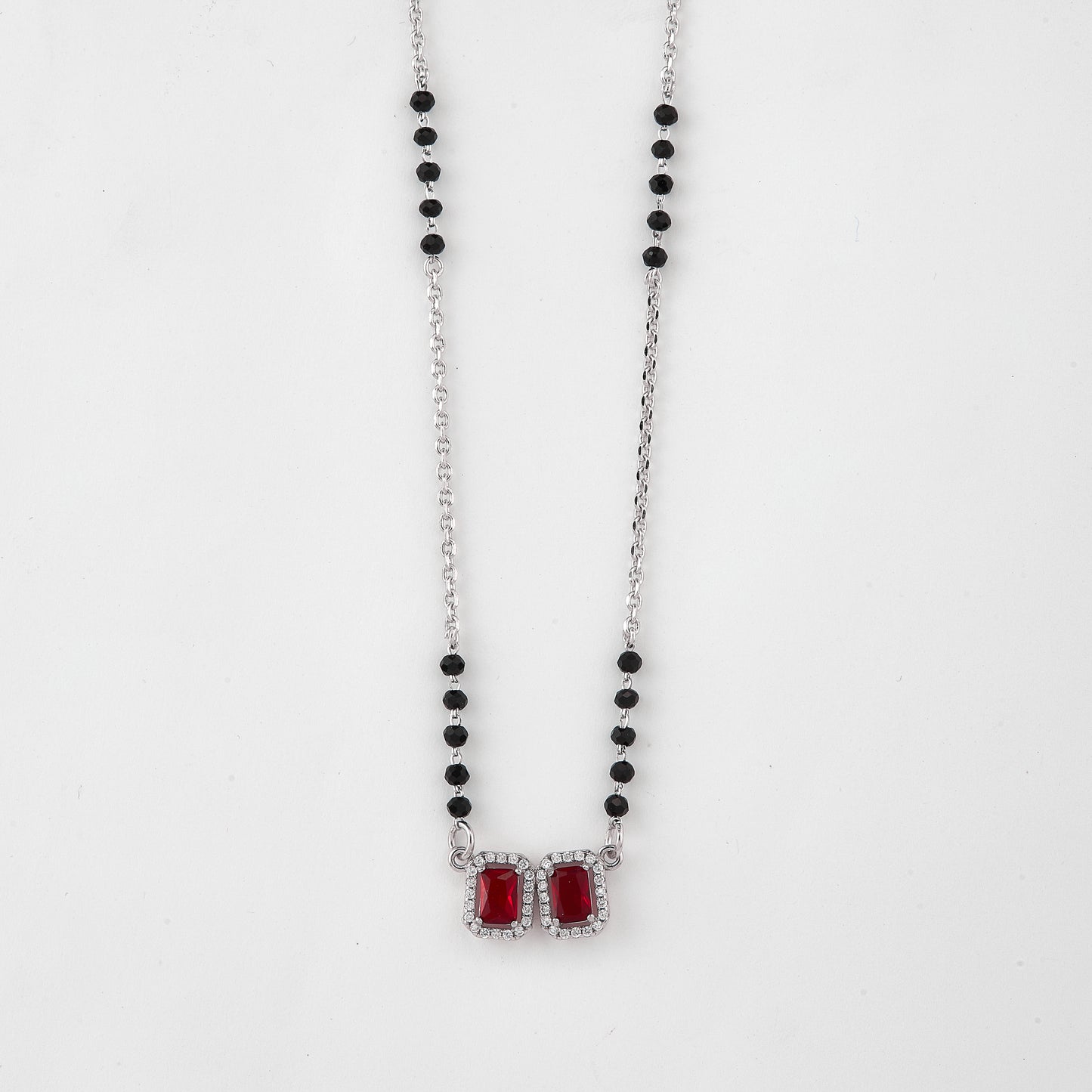 elegant silver-tone mangalsutra with black beads and dual rectangular halo pendants