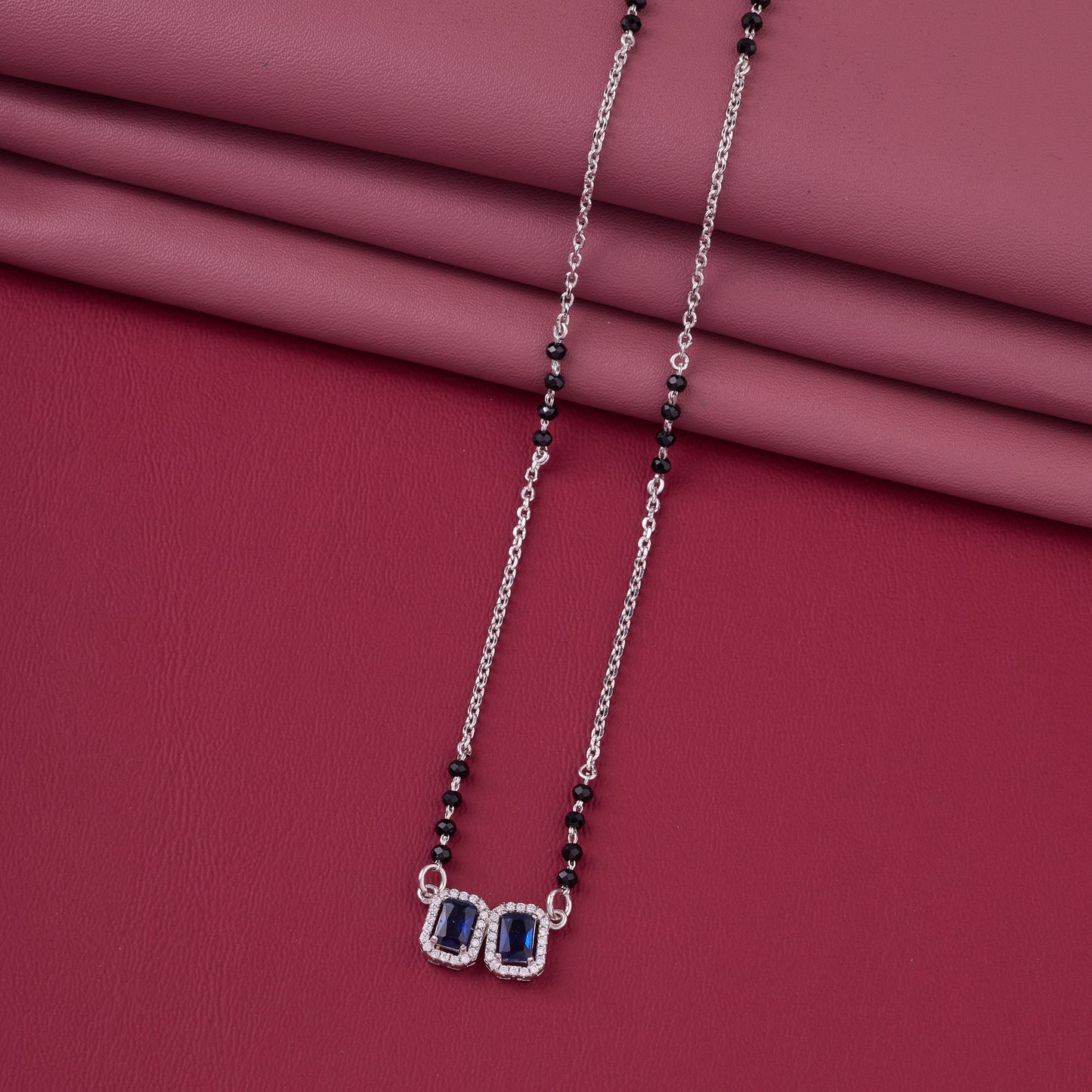elegant silver-tone mangalsutra with black beads and dual rectangular halo pendants