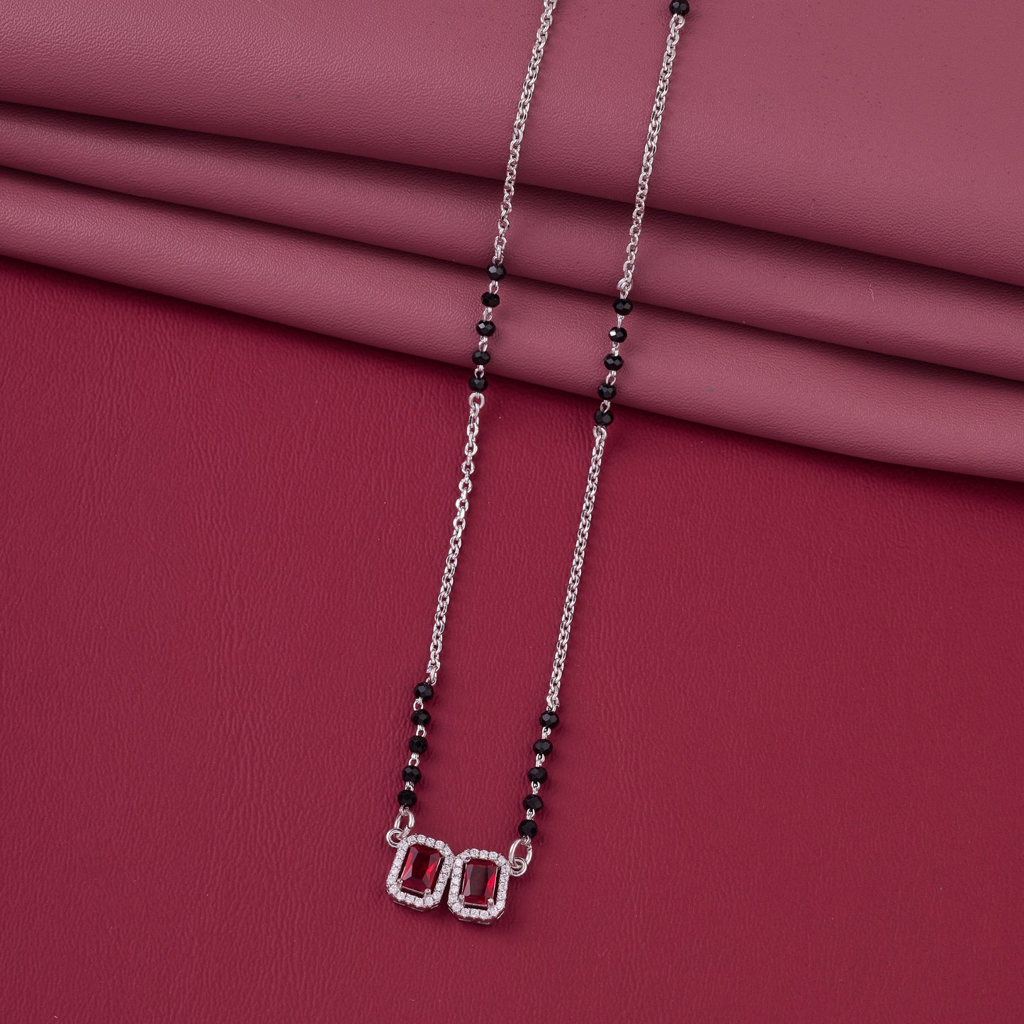 elegant silver-tone mangalsutra with black beads and dual rectangular halo pendants