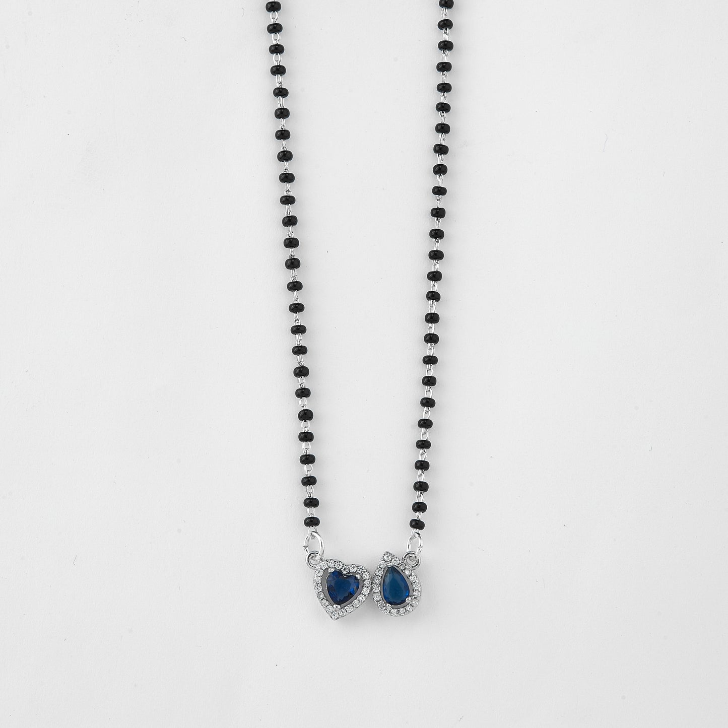 elegant silver-tone mangalsutra with black beads and dual heart & teardrop halo pendants