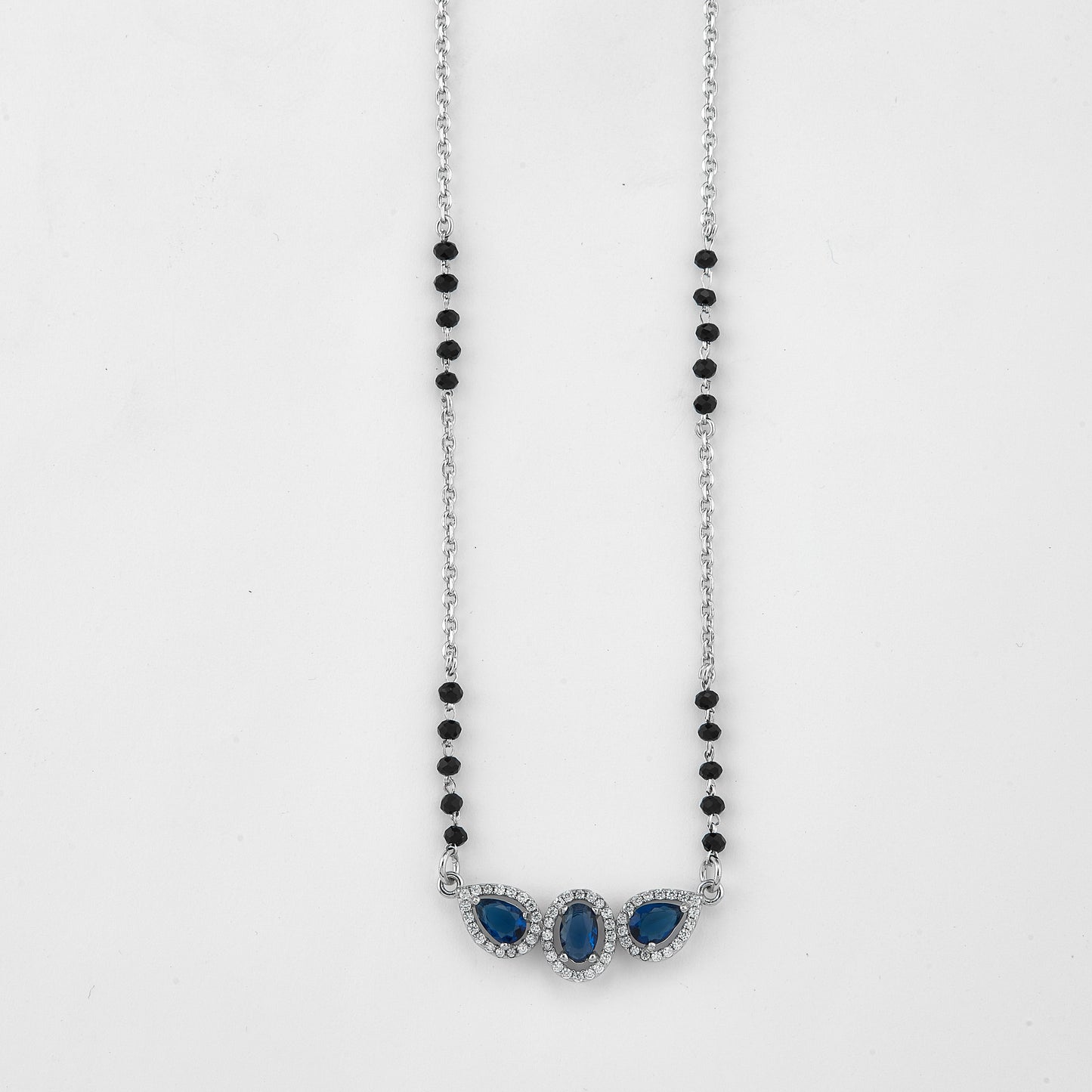 elegant silver-tone mangalsutra with black beads and triple blue teardrop halo pendant