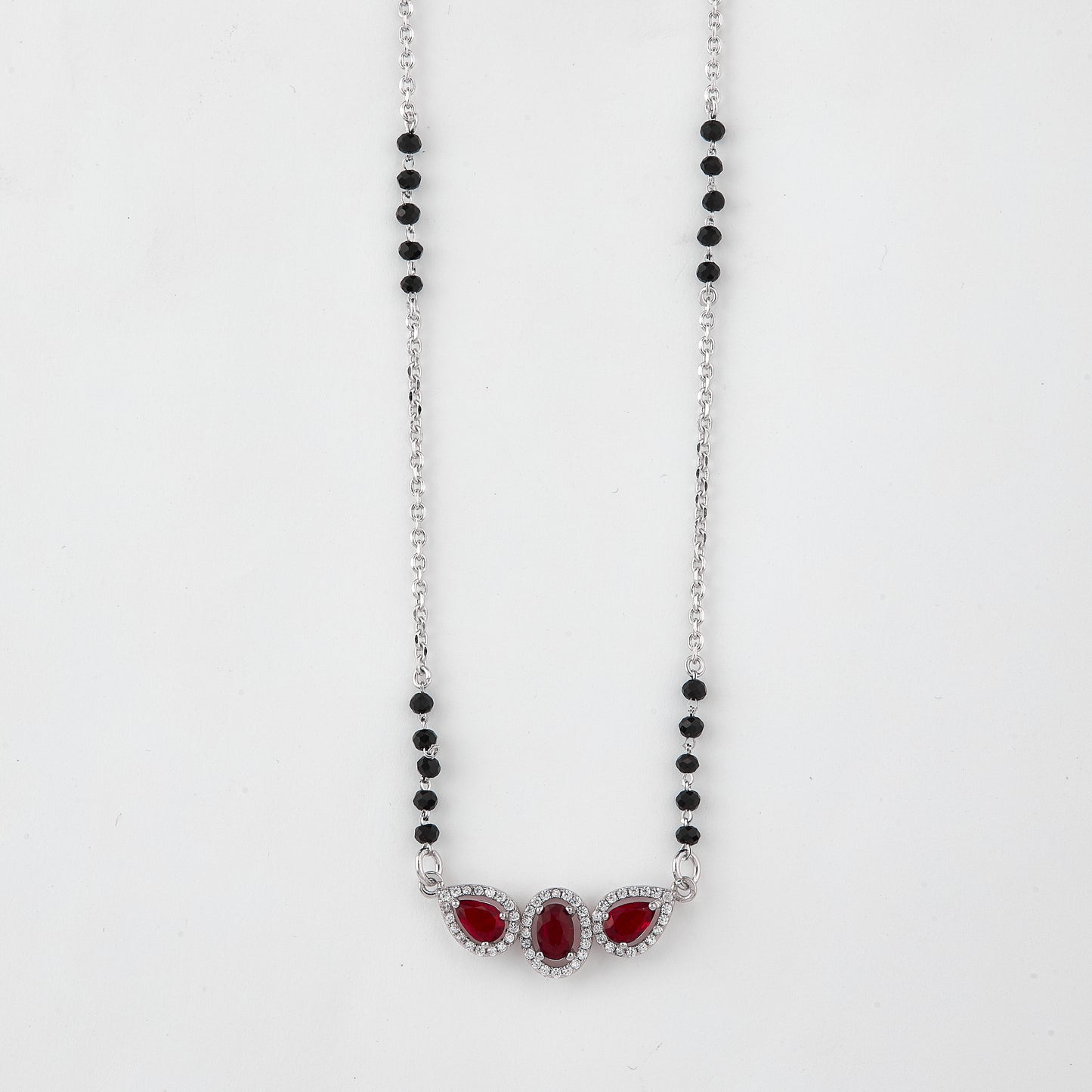 elegant silver-tone mangalsutra with black beads and triple blue teardrop halo pendant