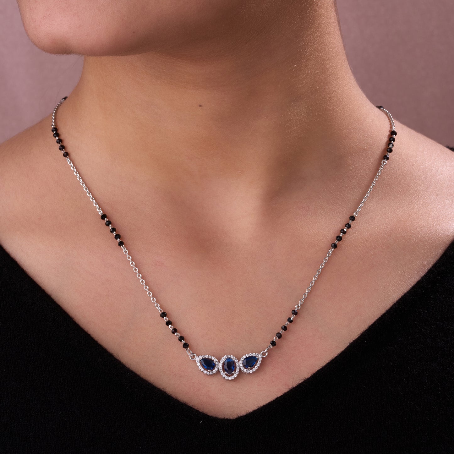 elegant silver-tone mangalsutra with black beads and triple blue teardrop halo pendant