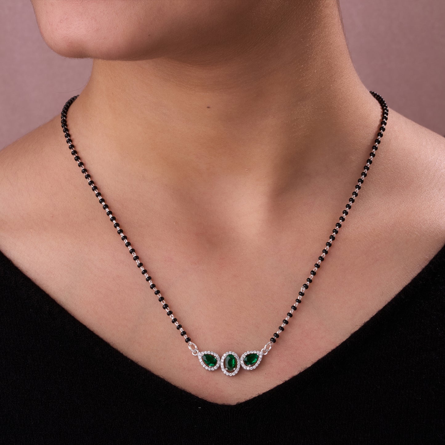 elegant silver-tone mangalsutra with black beads and triple blue teardrop halo pendant