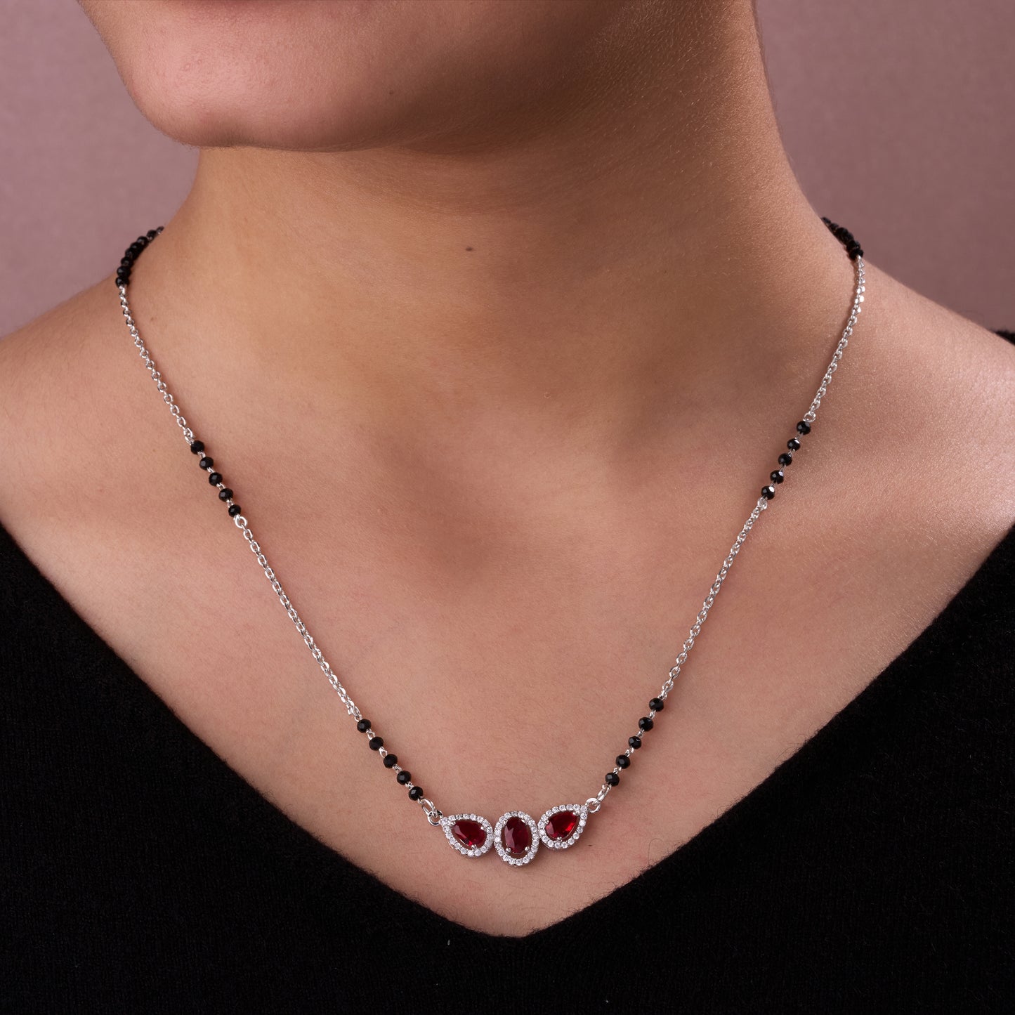 elegant silver-tone mangalsutra with black beads and triple blue teardrop halo pendant