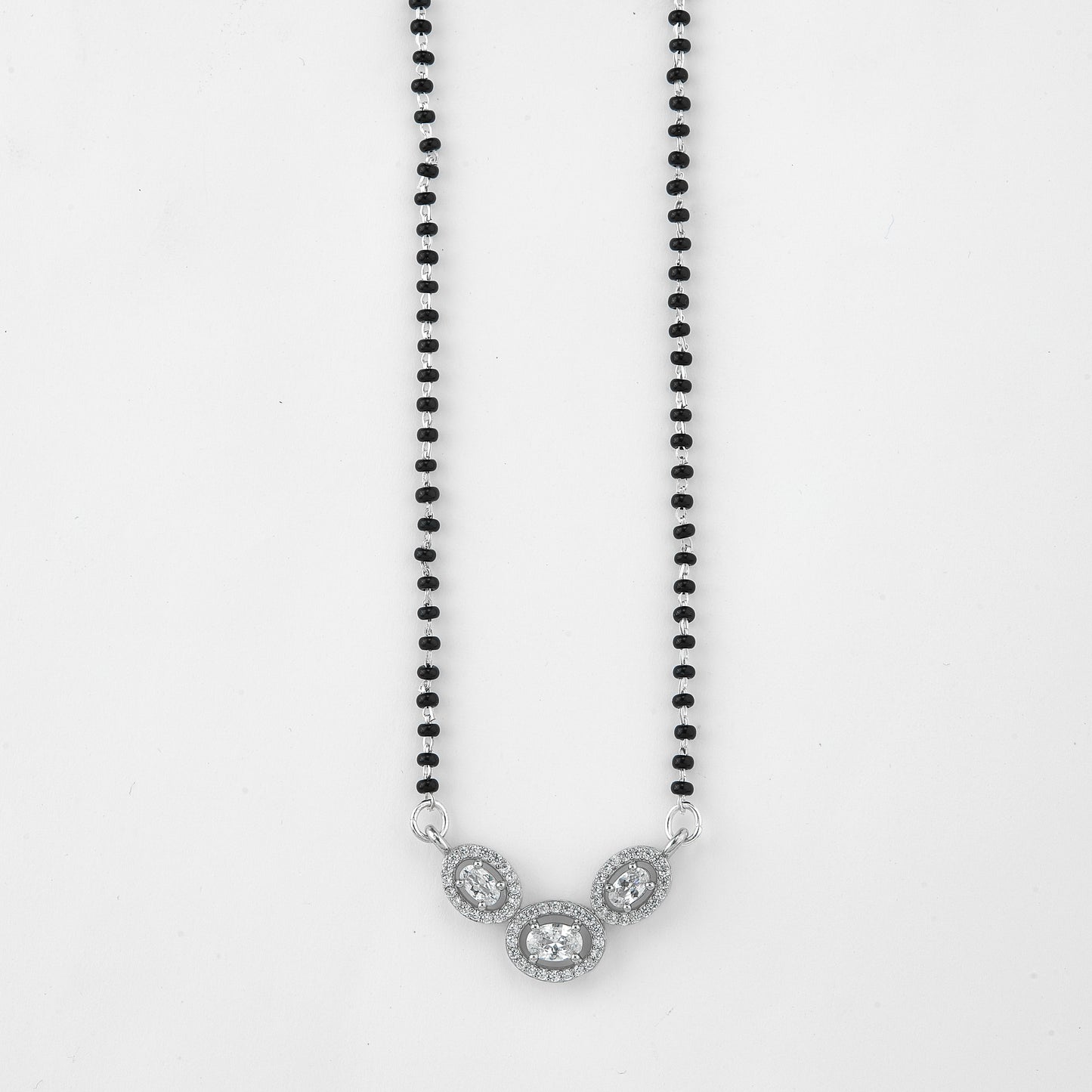 elegant silver-tone mangalsutra with black beads and triple oval crystal halo pendant