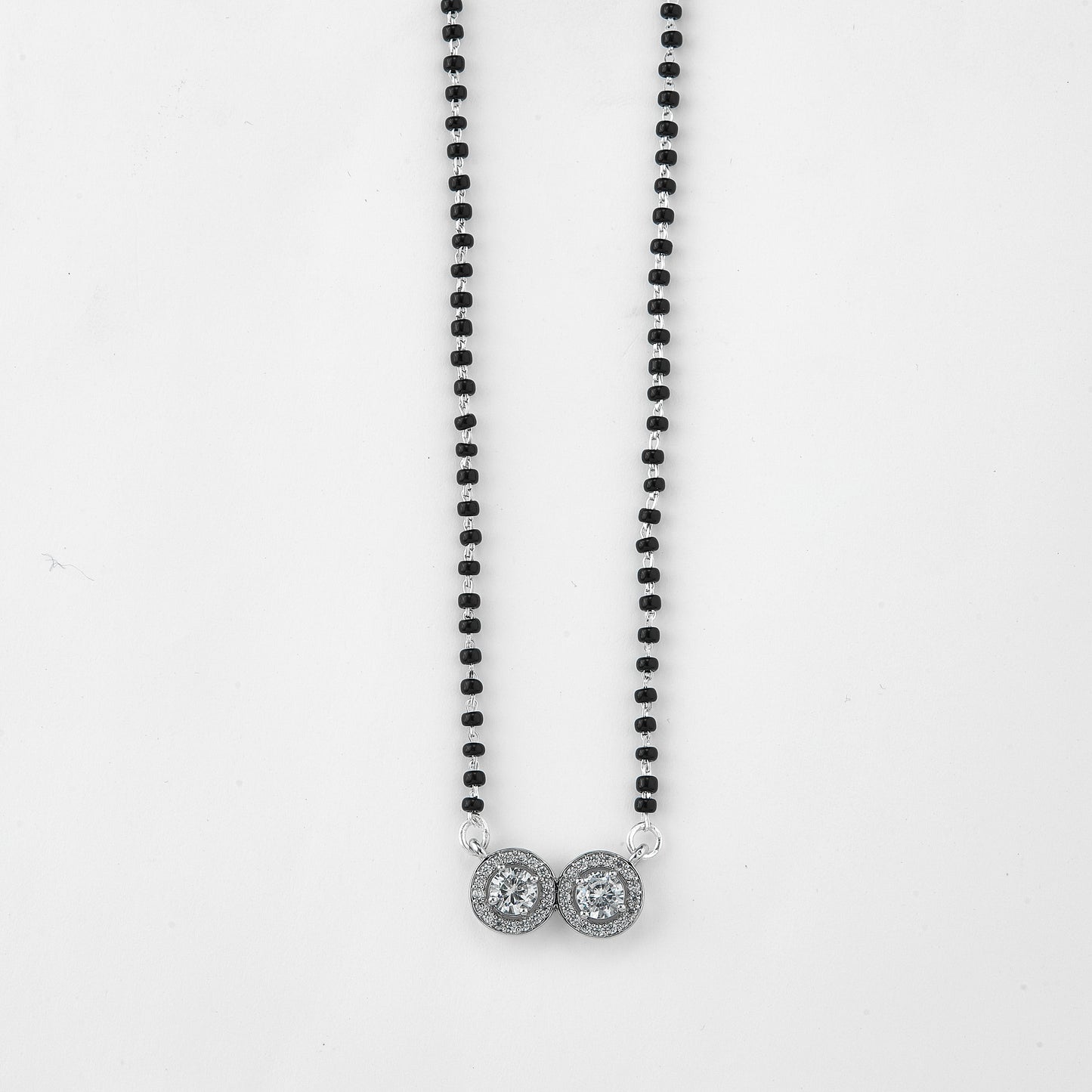 elegant silver-tone mangalsutra with black beads and dual round crystal halo pendants