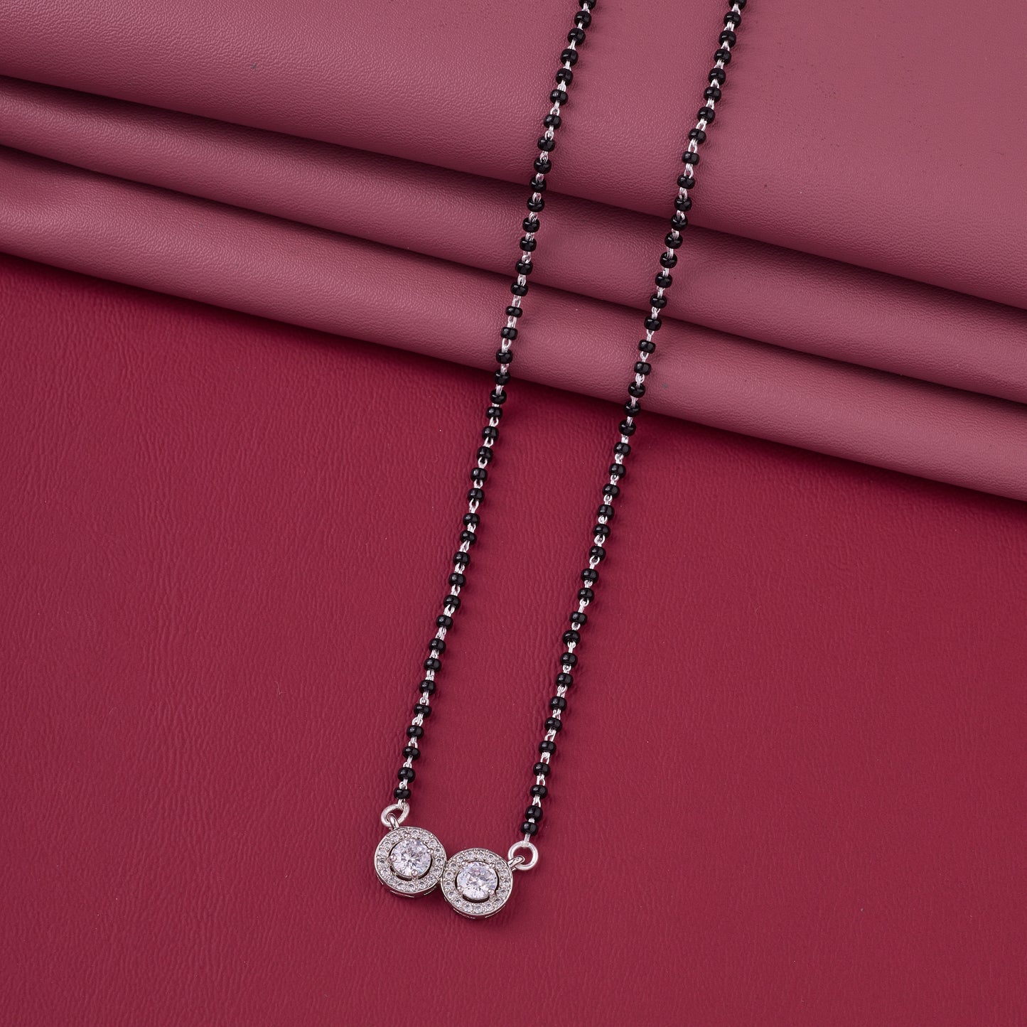 elegant silver-tone mangalsutra with black beads and dual round crystal halo pendants