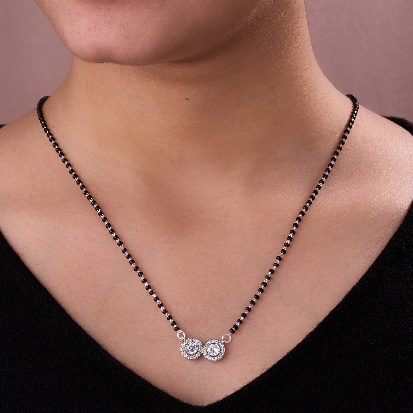 elegant silver-tone mangalsutra with black beads and dual round crystal halo pendants