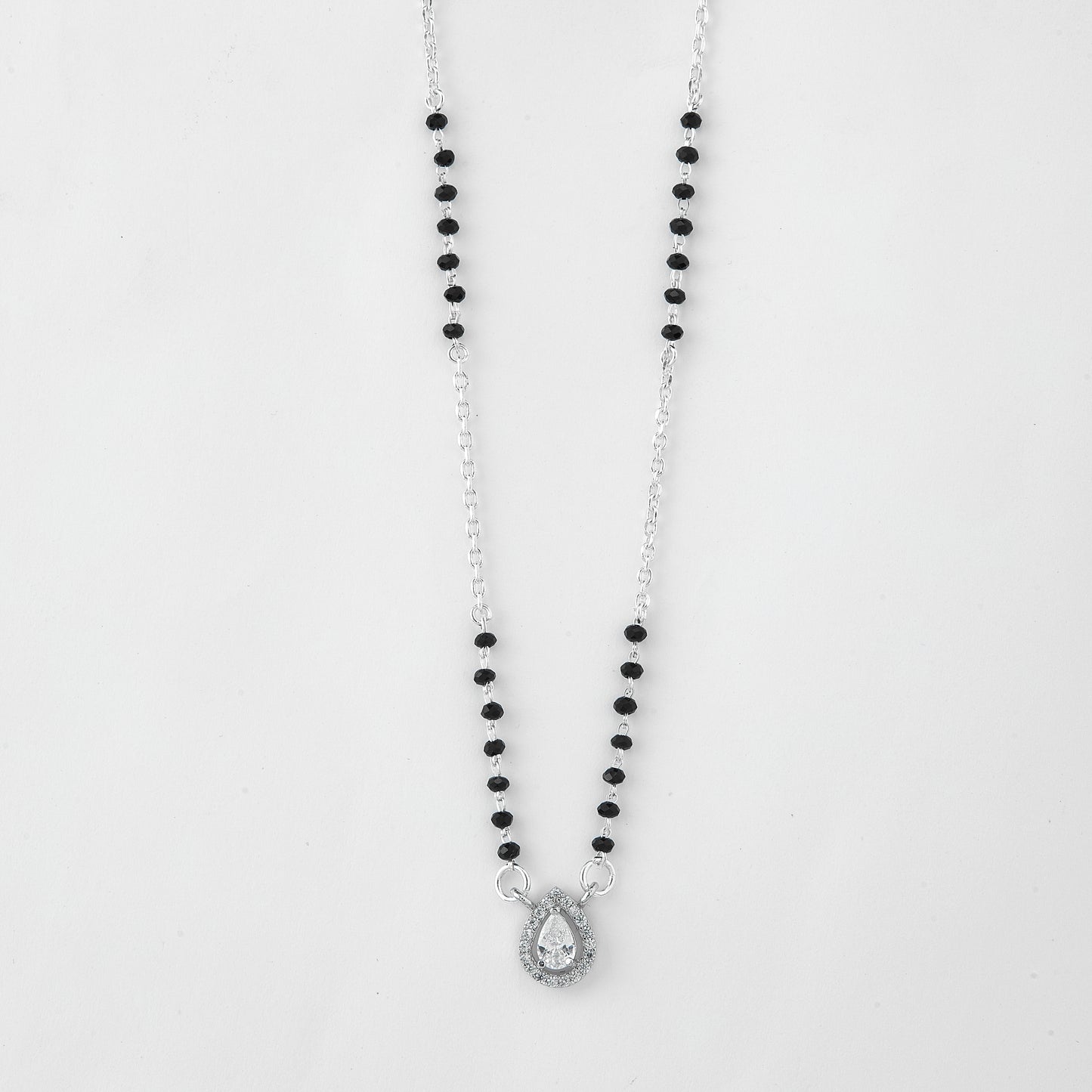 elegant silver-tone mangalsutra with black beads and teardrop crystal halo pendant