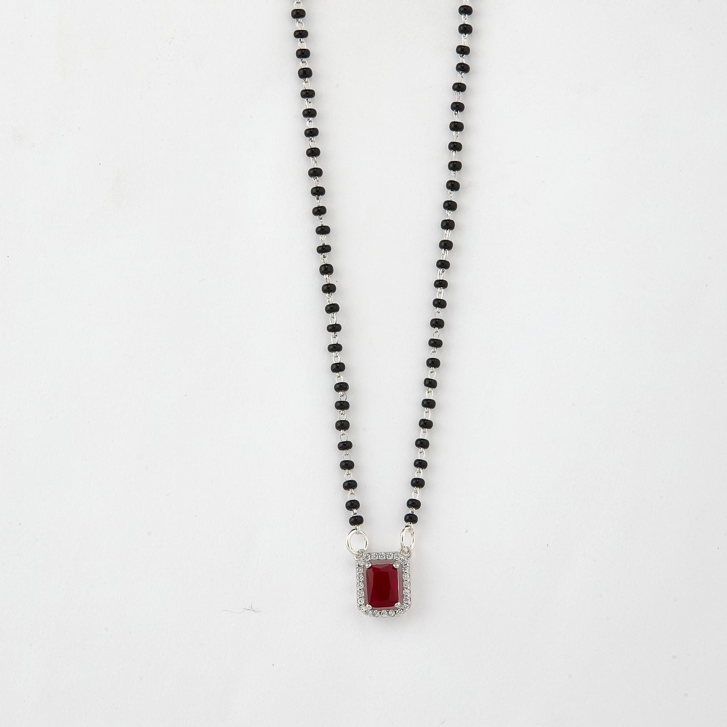 elegant silver-tone rectangular ruby crystal mangalsutra with black beaded chain