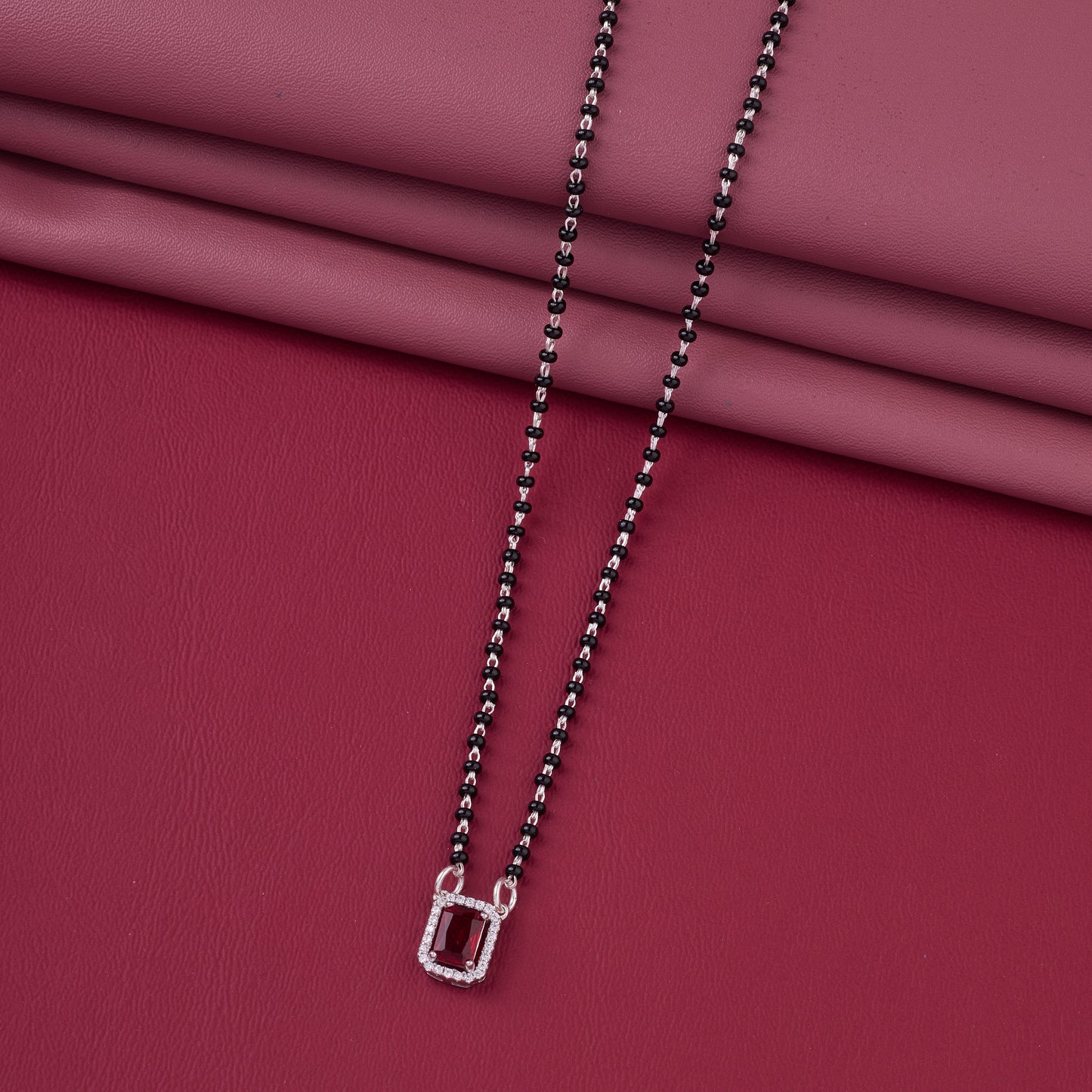 elegant silver-tone rectangular ruby crystal mangalsutra with black beaded chain