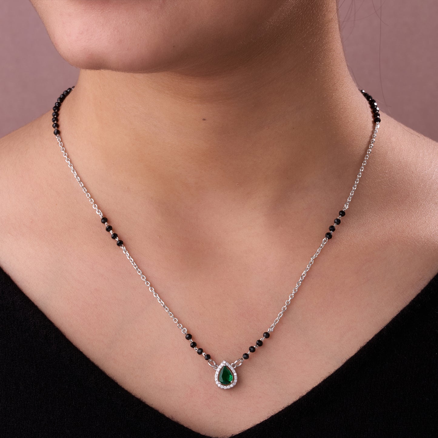 elegant silver-tone teardrop green crystal mangalsutra with black beaded chain