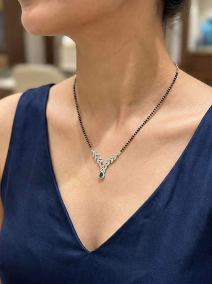 Elegant Silver-Tone Leaf Design Mangalsutra with Green Teardrop Crystal and Black Beaded Chain