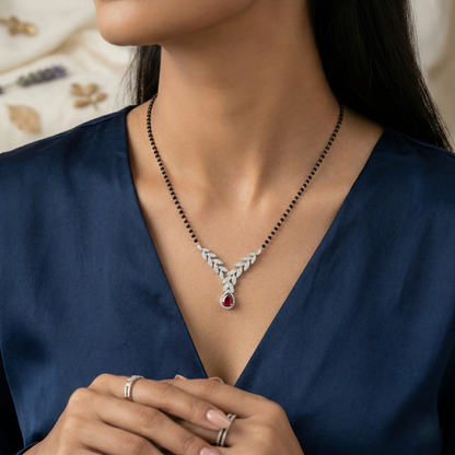 Elegant Silver-Tone Leaf Design Mangalsutra with Green Teardrop Crystal and Black Beaded Chain