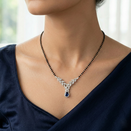 Elegant Silver-Tone Leaf Design Mangalsutra with Green Teardrop Crystal and Black Beaded Chain