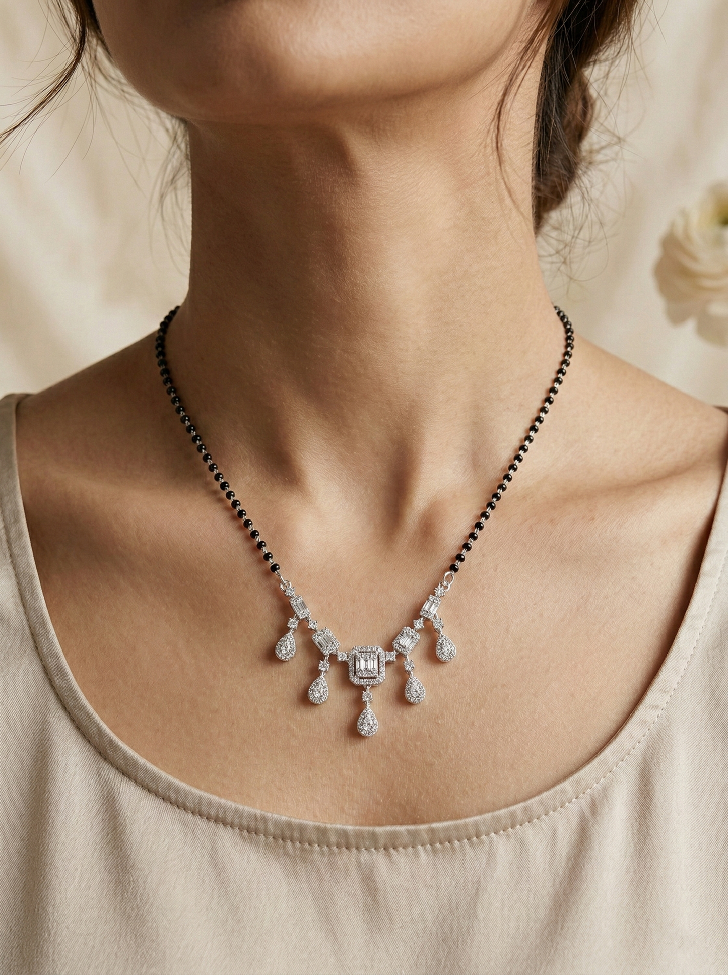 elegant silver-tone baguette & teardrop crystal mangalsutra with black beaded chain